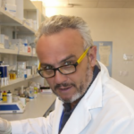 Dr. Romero in the lab at NIA clean Dr. Jorge Romero working in a laboratory at the National Institute on Aging (NIA) in Baltimore.